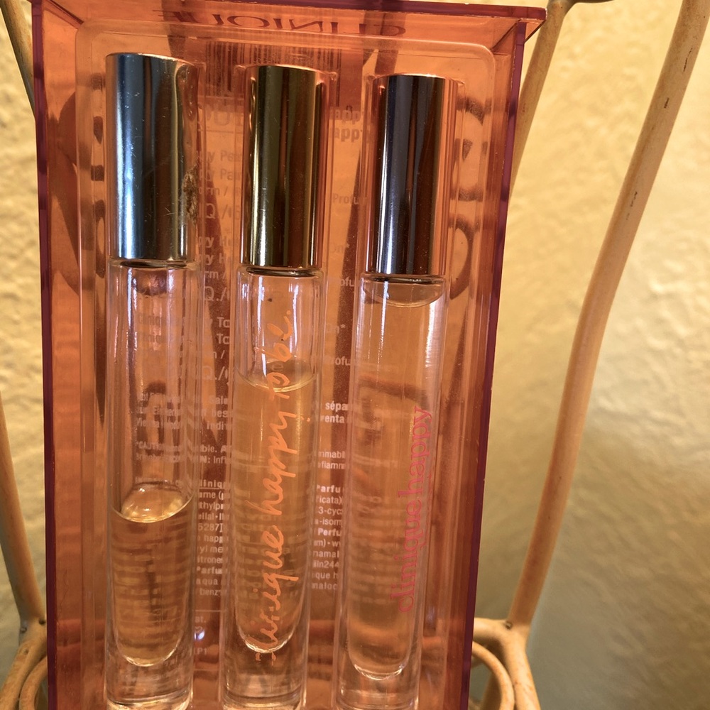 Retro Set of 3 Clinique Happy roll on perfumes.